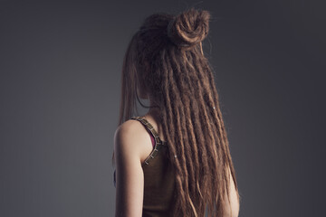 Portrait of young woman,  dreadlocks and long hair￼