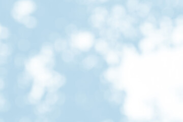 Abstract light blue blur bokeh for background, light blur on high light blue gradient abstract background in central design for presentation.