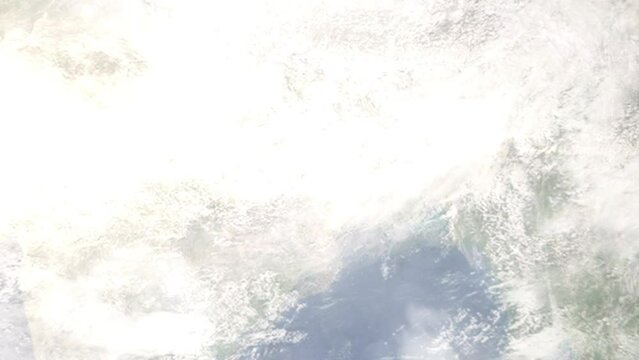 Earth zoom in from outer space to city. Zooming on Bokaro Steel City, Jharkhand, India. The animation continues by zoom out through clouds and atmosphere into space. Images from NASA
