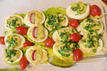 Boiled eggs in salad with lettuce and vegetables served for Easter in Poland, Europe