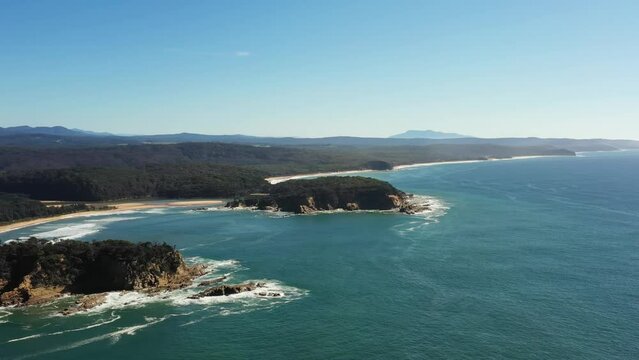 Wide aerial panorama of Sapphire coast near Tathra beach and bega river.
