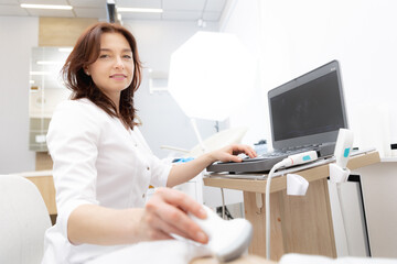 Professional doctor woman use ultrasound scanner device for examining patient female