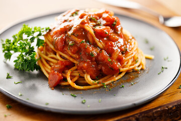 spaghetti tomato sauce with chopped parsley.