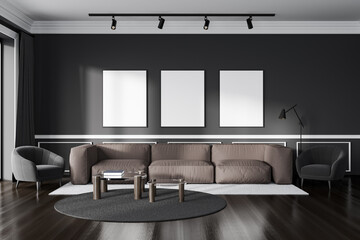 Living room interior with couch and coffee table, mockup frames