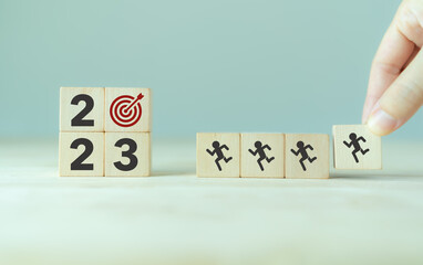 2023 goals of business or life. Team building. Wooden cubes with 2023 and goal icon. Starting to new year. Business common goals for planning new project, annual plan, business target achievement