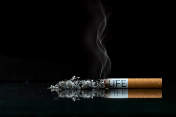 World No Tobacco Day Concept. Stop Smoking. Tobacco cigarette butts with the word life on the...