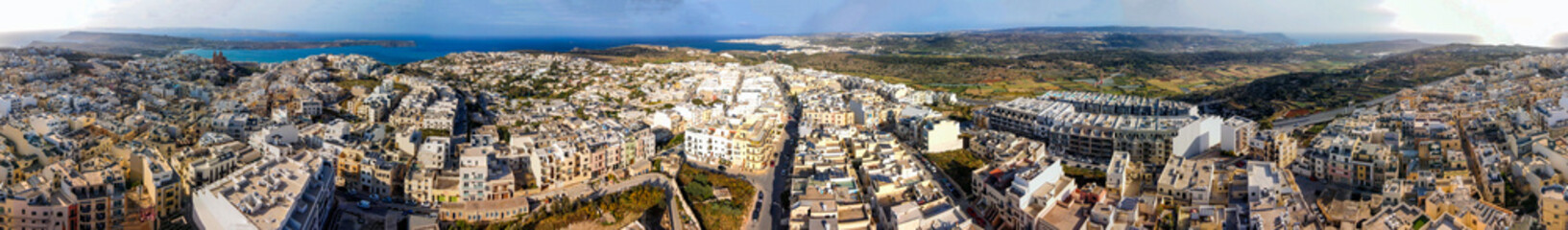 Obraz premium Aerial view of Mellieha cityscape from drone, Malta