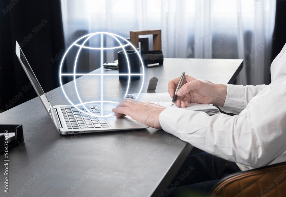 Poster businessman working on laptop, searching information on internet, taking notes in planner, analyzing