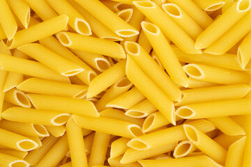 Italian pasta penne background. Top view.