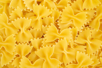 Italian pasta farfalle background. Top view.