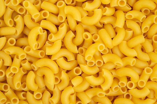 Italian pasta coquillette background. Top view.