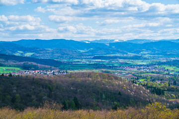 Fototapeta na wymiar Germany, Panorama view above tree tops of schwarzwald nature landscape from emmendingen viewpoint with view unto feldberg covered with snow