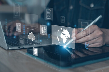 Business analysis using technology, documents virtual touch screen. Man working on laptop computer on desk in office. Data Discovery, Big Data Management, Cloud computing, Database Access, Security.