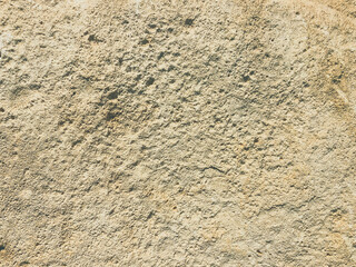 stone texture from natural, natural material. gray background, three-dimensional, with cracks. compressed sand with holes