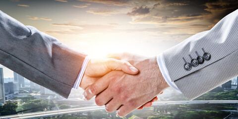Partnership concept. Image of handshake