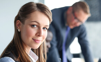 business woman with her staff, people group in background at modern bright office indoors