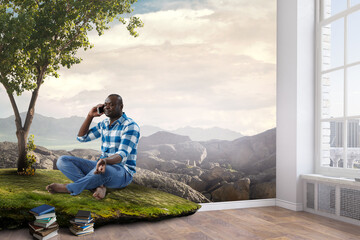 Fototapeta na wymiar Young black man sitting and meditating