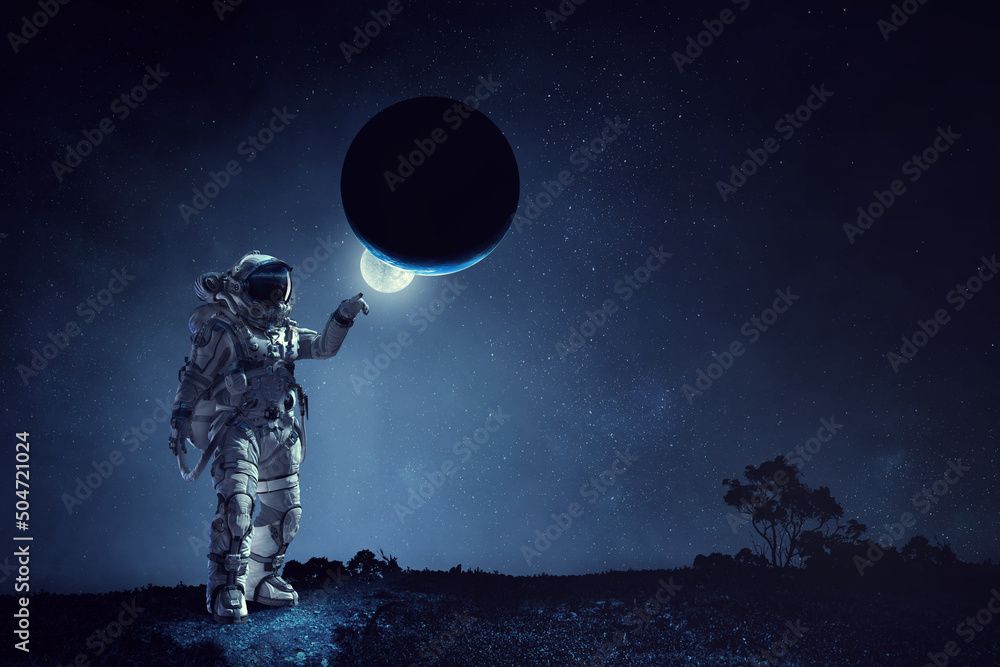 Wall mural astronaut walking on an unexplored planet