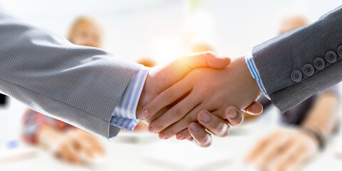Partnership concept. Image of handshake . Mixed media