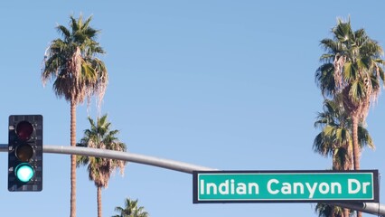 Palm trees and blue sky, Palm Springs resort city near Los Angeles, street road sign, semaphore...