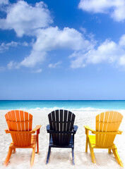 Three beach chairs on Caribbean coast © elvirkin