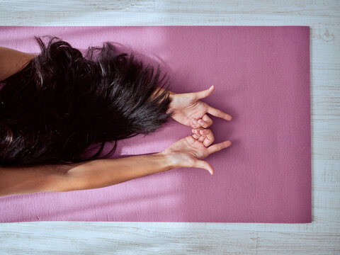 Crop Woman Lying On Purple Yoga Mat