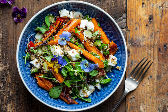 Quinoa salad with roast carrots and vegan cheese