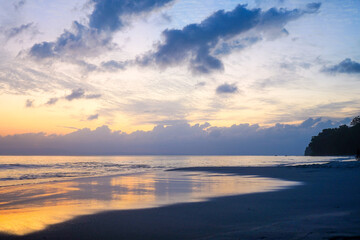 Fototapeta na wymiar Empty beach with the orange blue cloudy sky shot in kalapathar beach havelock andaman nicobar island India