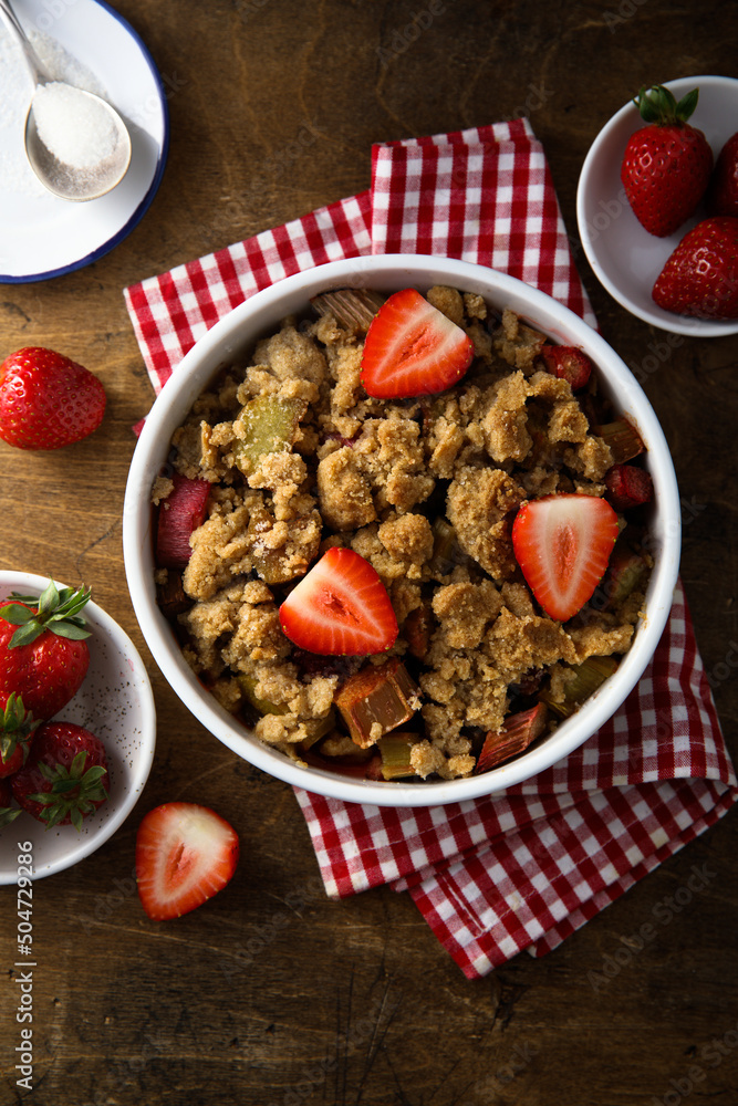 Sticker homemade rhubarb crumble with strawberry