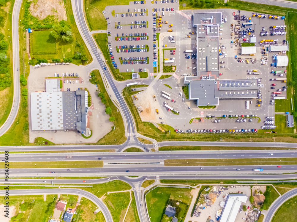 Poster aerial view of colorful trucks in the terminal waiting for unloading. top view of the logistics cent