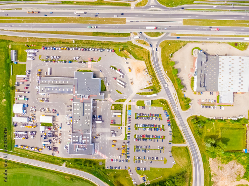 Poster aerial view of colorful trucks in the terminal waiting for unloading. top view of the logistics cent