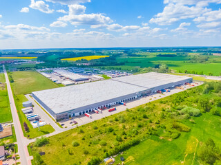 Aerial view of goods warehouse. Logistics center in industrial city zone from above. Aerial view of...
