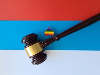 Lgbt sign judge gavel on Russian flag.