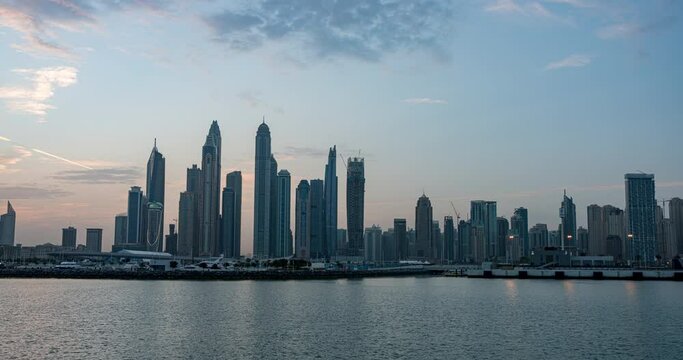 Sunrise timelapse ofskyscrapers in Dubai Marina, UAE