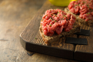 Homemade steak tartare with rye bread