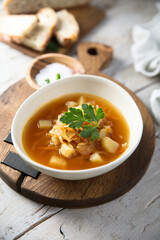 Traditional homemade sauerkraut soup with fresh parsley