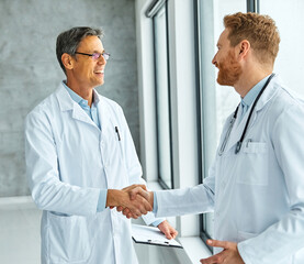 doctor hospital team teamwork health medicine healthcare meeting handshake agreement hand shake shaking senior  introduction greeting medical