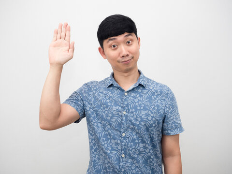 Asian man blue shirt shand up surrender