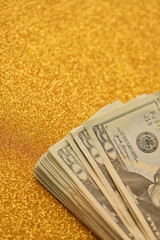 Big amount of old twenty dollar bills on golden background. Money earnings, payday or tax paying...