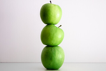 Green apples on a white background close-up.