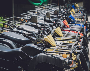 Fototapeta premium View of row dirty ATVs quad bike