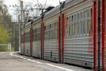 Fototapeta na wymiar Suburban electric train cars on the platform of the station 
