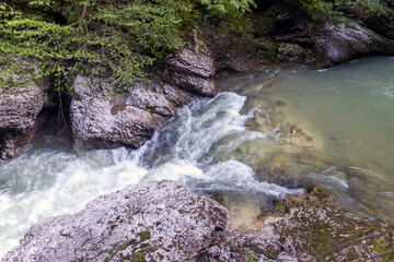 Fototapeta premium landscape with gorge and mountain river. Waterfall on a mountain river in the forest