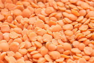 orange lentil beans. background closeup.