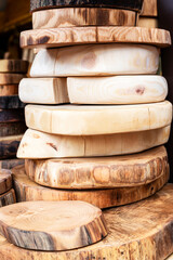 Market with wooden cutting boards from various types of wood - beech, oak, pine, spruce, ash, linden homemade products for cooking