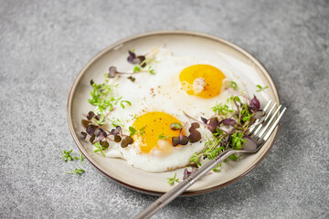 Healthy breakfast. Eggs with micro greens, granola with yogurt and coffee.