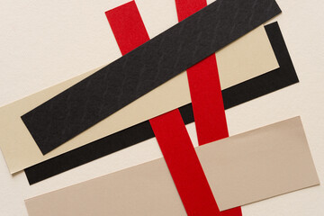 background with paper (red, black, beige strips)