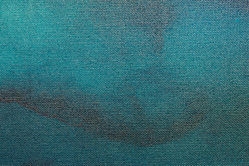Blue canvas paint texture background on canvas. Modern fluid art background.