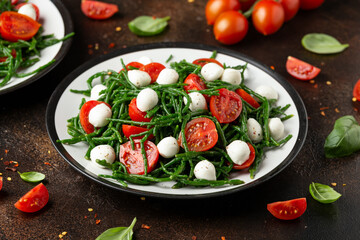 Fresh Samphire salad with cherry tomatoes and mozzarella. Healthy food.