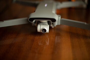 Fototapeta na wymiar Drone is on table. Copter with video camera.